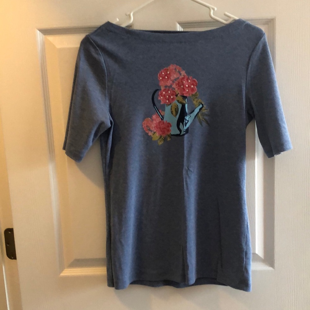 Light blue small shirt.